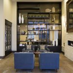Interior of apartment lobby with modern fireplace and sitting area