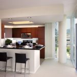 Interior of bar counter and kitchen in a high-rise apartment.