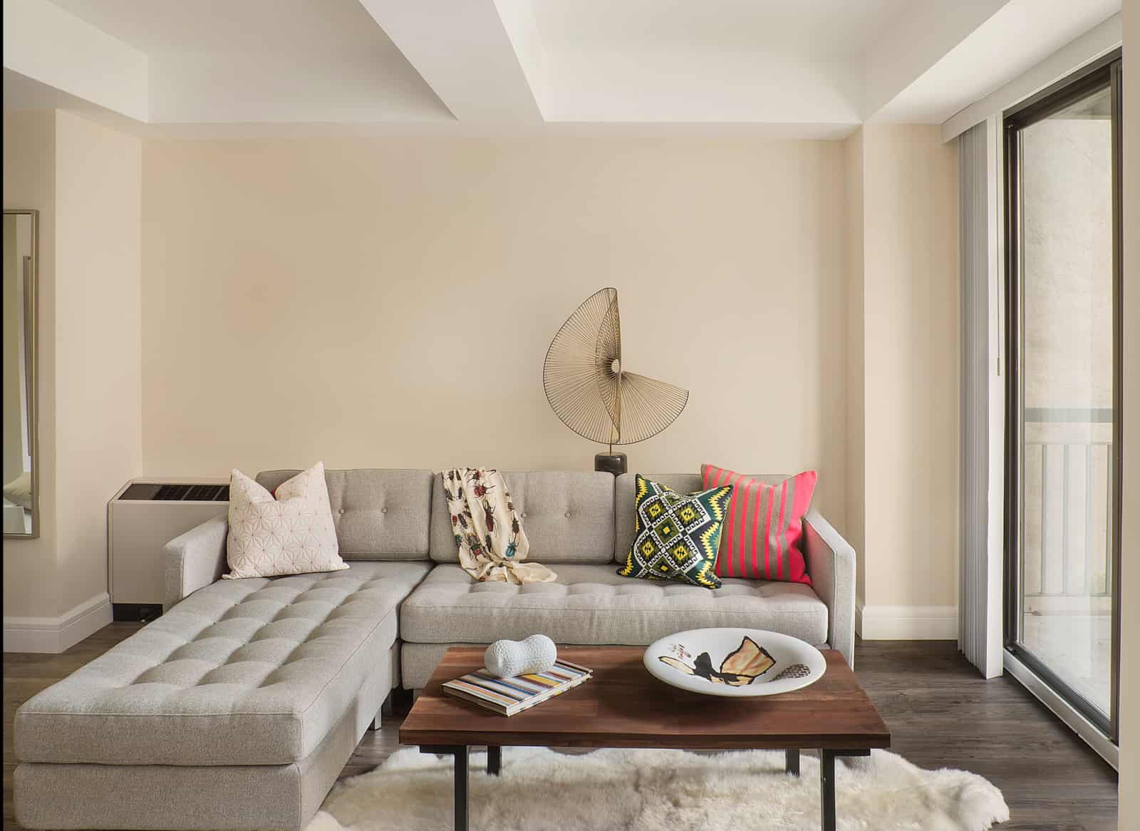 Interior of apartment living room with modern couch and coffee table.