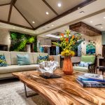 Interior of seating area with couch, chairs, and coffee table.