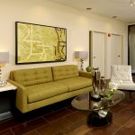 Interior of the lobby with couch, chair, coffee table and side tables.