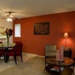 Interior of a living and dining room area and pass through to kitchen.