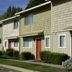 Exterior of 2 story units with red doors.