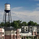View of the top of the buildings with the water tower in the background.