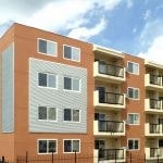 Exterior of apartment building with balconies.