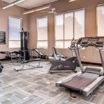 Fitness center with various exercise equipment.