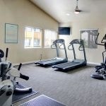 Fitness center with exercise equipment.