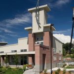 Exterior of leasing center with the water tower in the background.