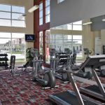 Fitness center with various exercise equipment.