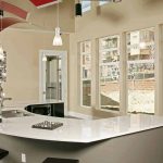 Common area kitchen with a u-shaped counter and barstool seating.