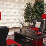 Detail of the common area with 4 wing chairs, coffee table, and floor lamps.