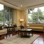 Interior of lobby with couch, chairs, coffee table, side tables, and lamps.
