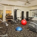 Fitness center with various exercise equipment.