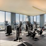 Interior gym with floor to ceiling windows and exercise machines