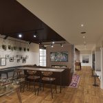 Interior game room with foosball table and seating area
