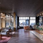 Interior of modern lobby with seating area and high ceilings