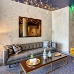 Interior lounge area in lobby with modern couch and chairs