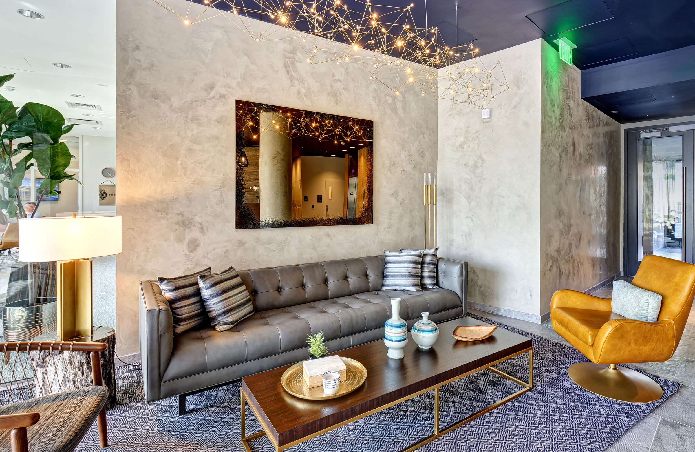 Interior lounge area in lobby with modern couch and chairs