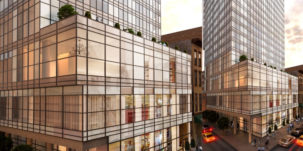 Aerial exterior of two modern apartment towers.