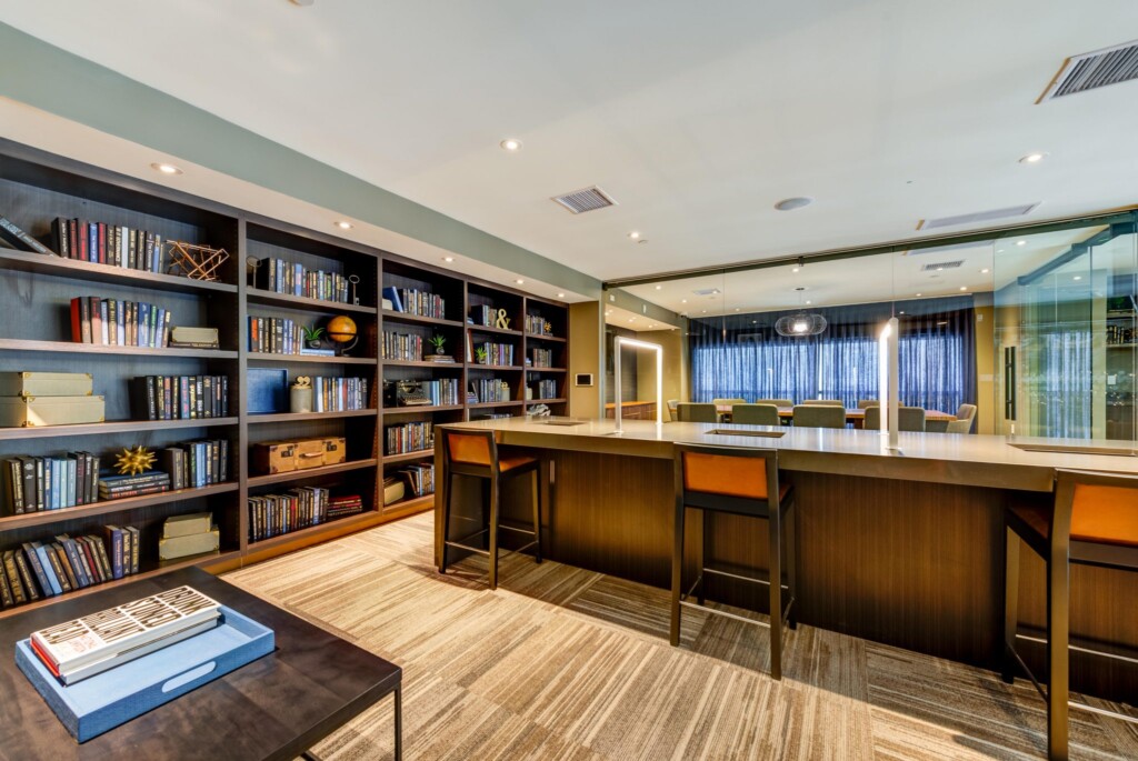 Interior of room with counter-height seating and book shelves