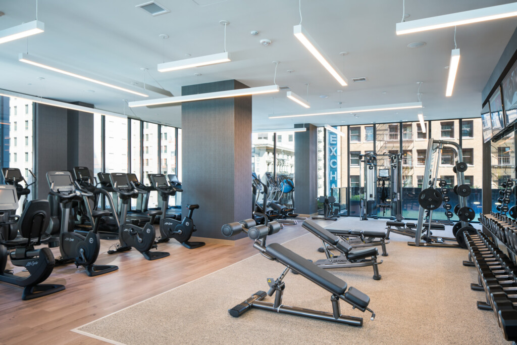 Interior of fitness center with free weights and other exercise machines