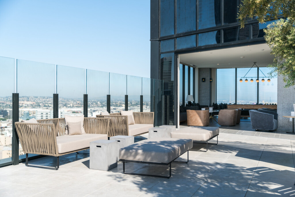 Exterior of rooftop common area with indoor and outdoor seating areas