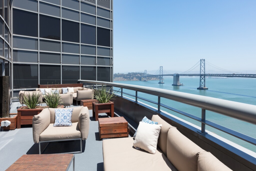 Outdoor deck with a view of the San Francisco Bay Bridge.