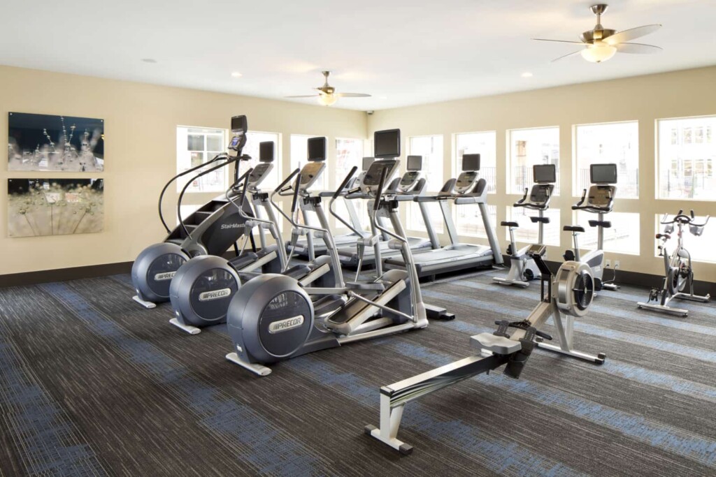 Interior of fitness center with treadmills, rowing machine and other equipment