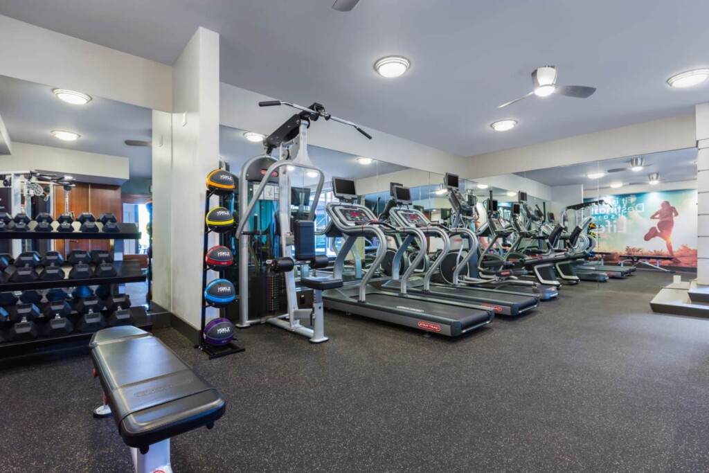 Interior of fitness center with free weights and other exercise machines