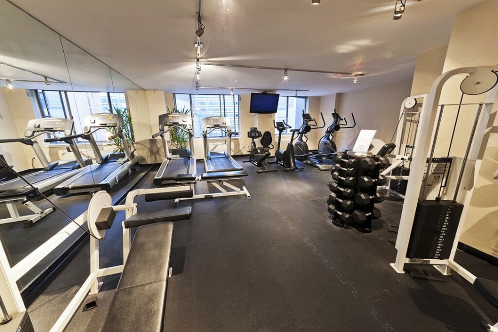 Interior of fitness center with free weights and exercise machines