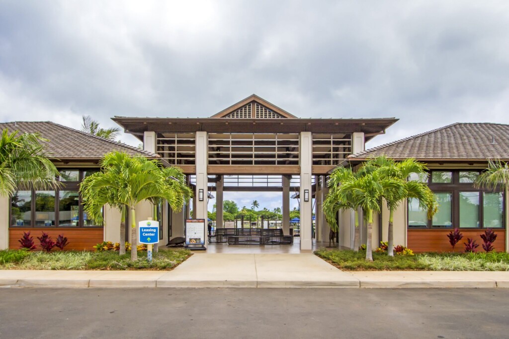 Street-level exterior of single-story buildings with open, covered entrance.