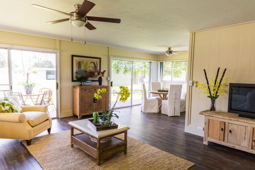 Apartment interior of open living room and dining area.