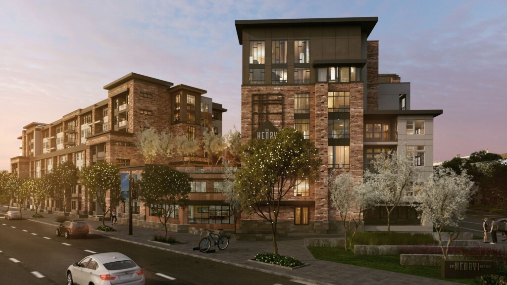 Exterior of 7-story apartment complex with sidewalk and roadway in foreground