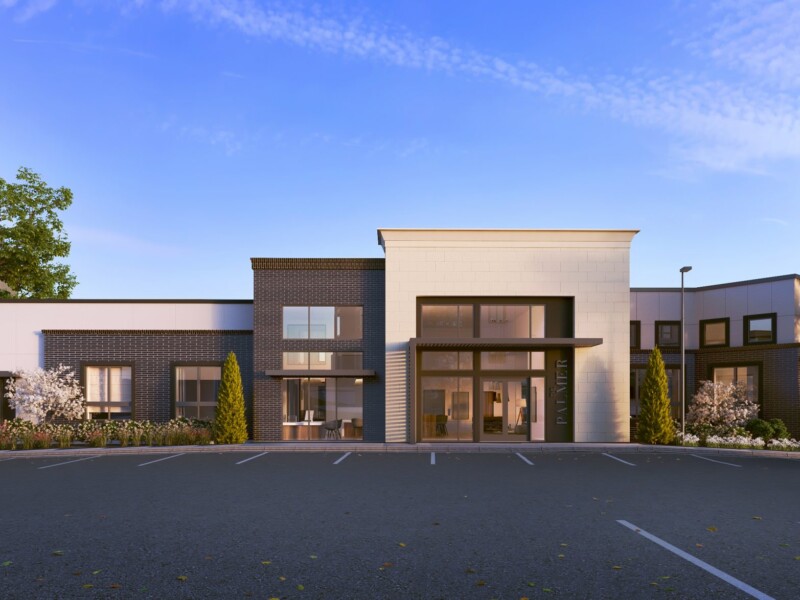 Exterior of single-story entrance with parking lot in foreground