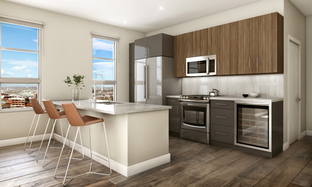 Apartment interior of modern, open kitchen with countertop seating and stainless steel appliances